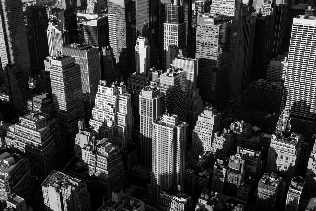 Strategic business consulting for growth – black and white aerial view of city skyscrapers